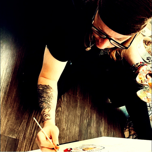 Jason Abadi painting at a table